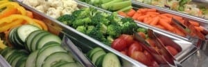 Fresh vegetable options at a salad bar.