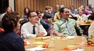 Large group of workers gathered for a wellness program kickoff meeting.