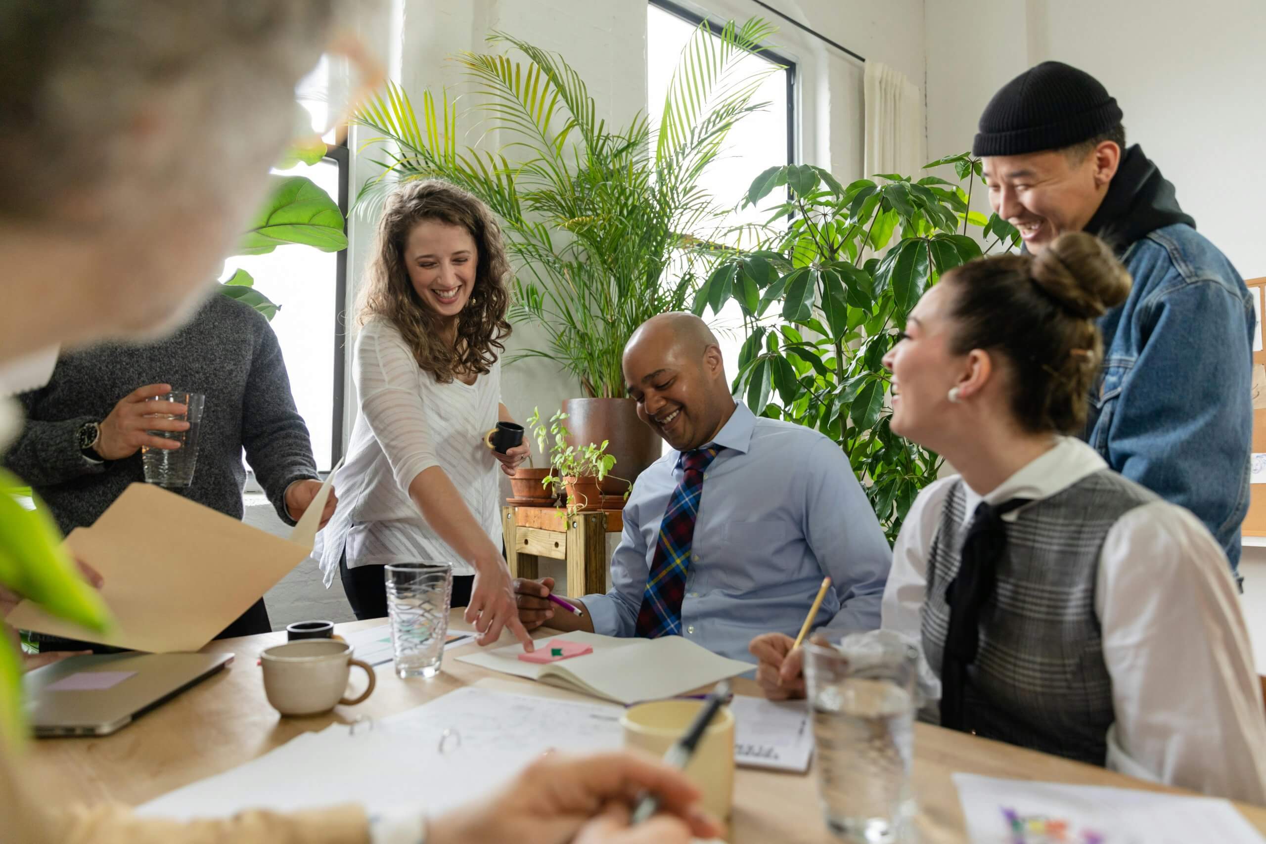 Group of employees gathering in breakroom chatting.