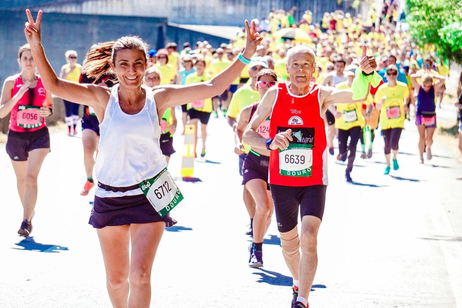 Two high level leadership members who are leading by example as they participate in a group exercise event.