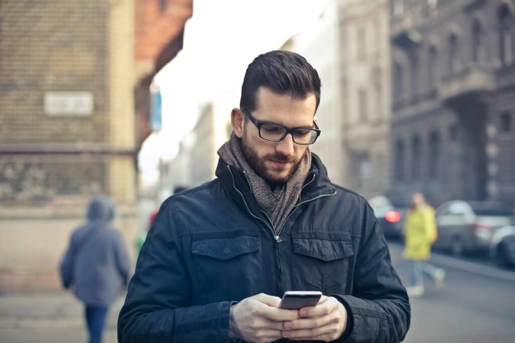 employee checking into digital wellness program from phone